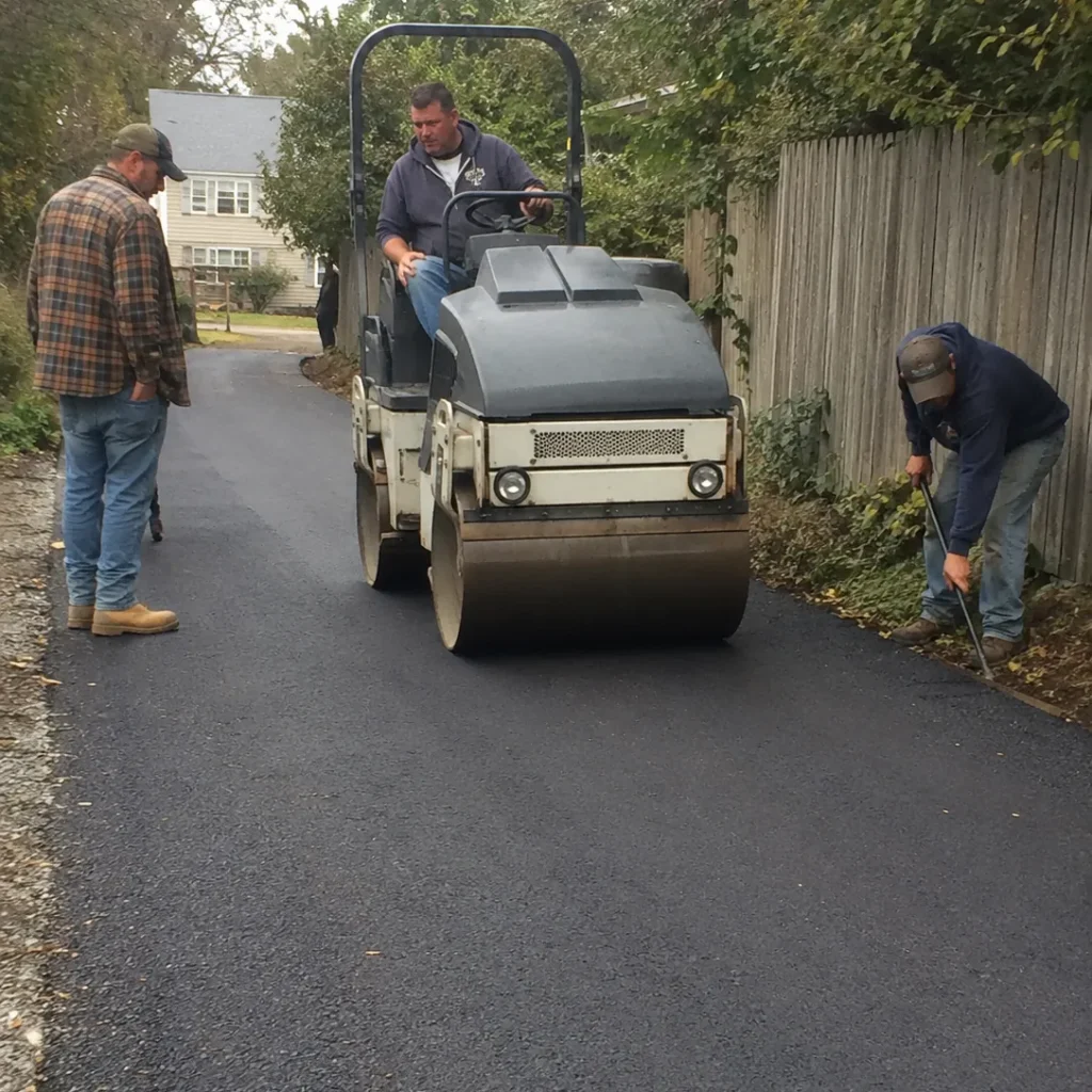 Paving Contractor in Southwest Ranches - FL measuring grade lines for a long residential driveway installation